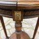 Old wooden pedestal table with marble top
