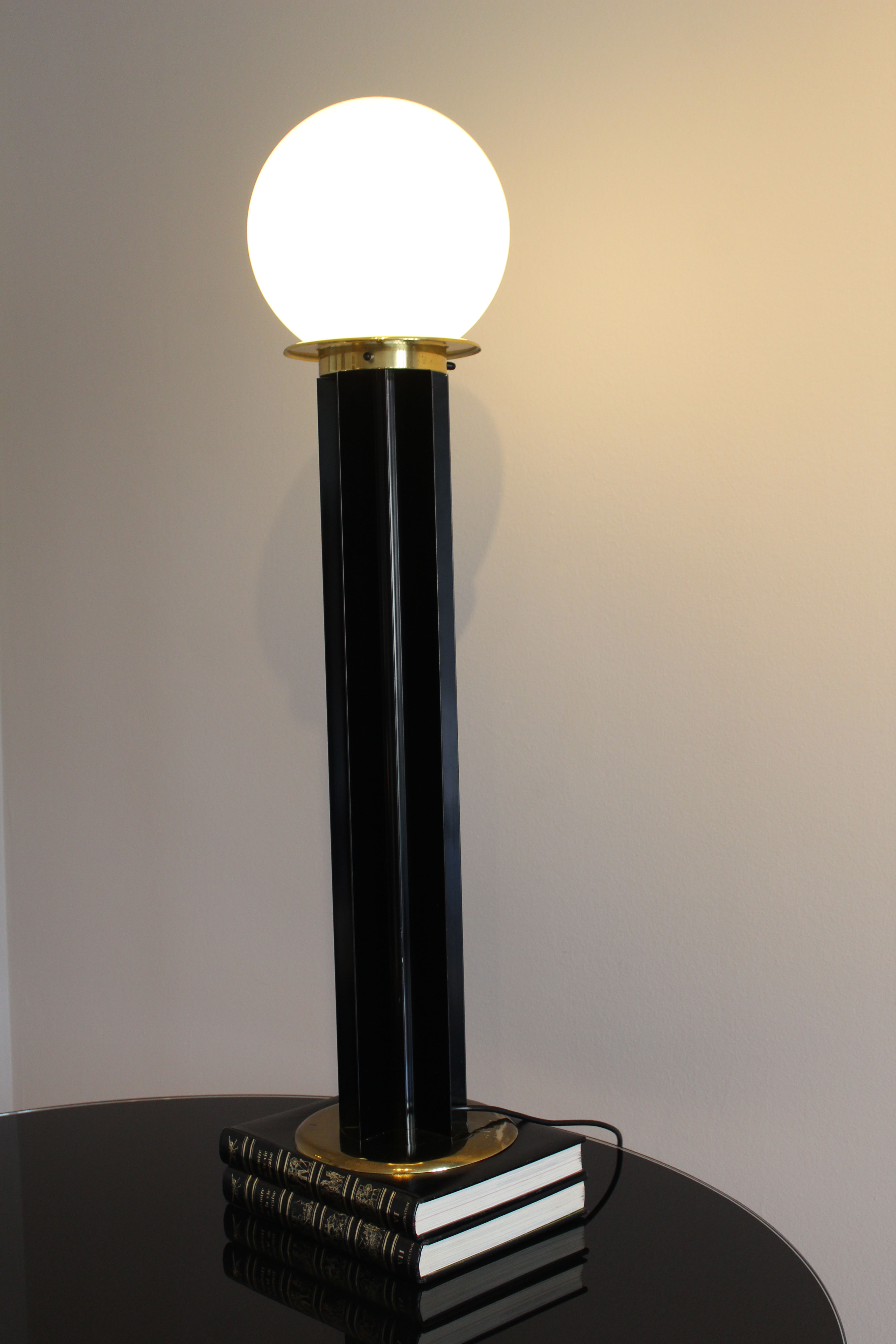 Floor lamp, Italy, 1970s, white glass ball, brass finishes, the star is in black lacquered i