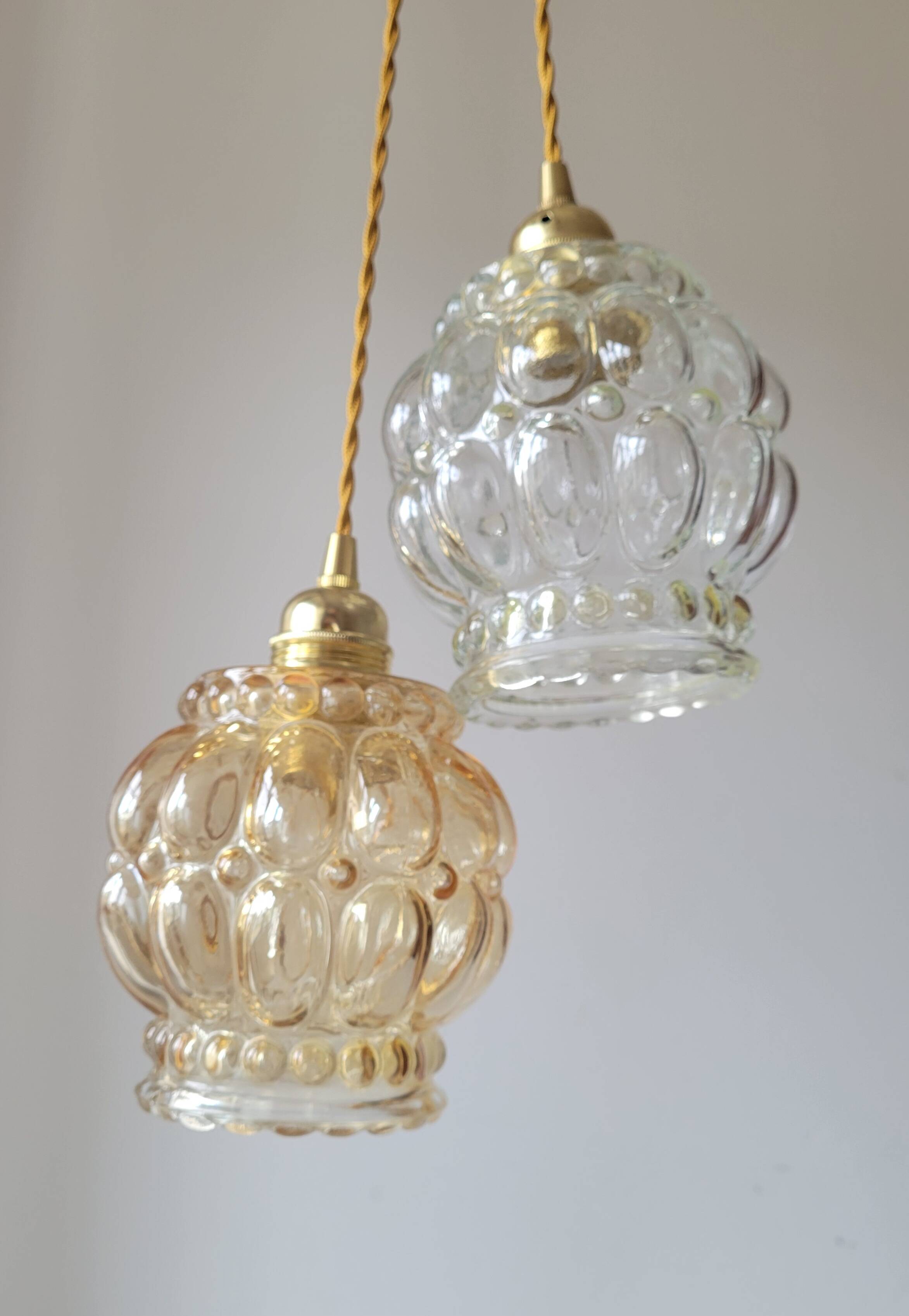 Duo of molded glass pendant lights
