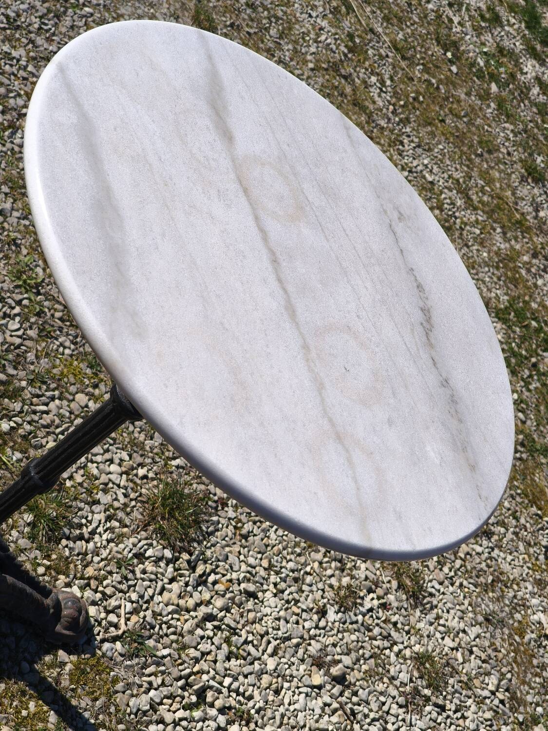 Marble bistro table with cast iron legs in Parisian café style