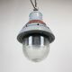 Grey industrial explosion proof light from Crouse-Hinds, 1970s