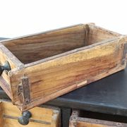 Black metal storage cabinet with 60 wooden drawers