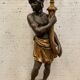 Torchère decoration of a nubian in wood and gilded stucco XX century