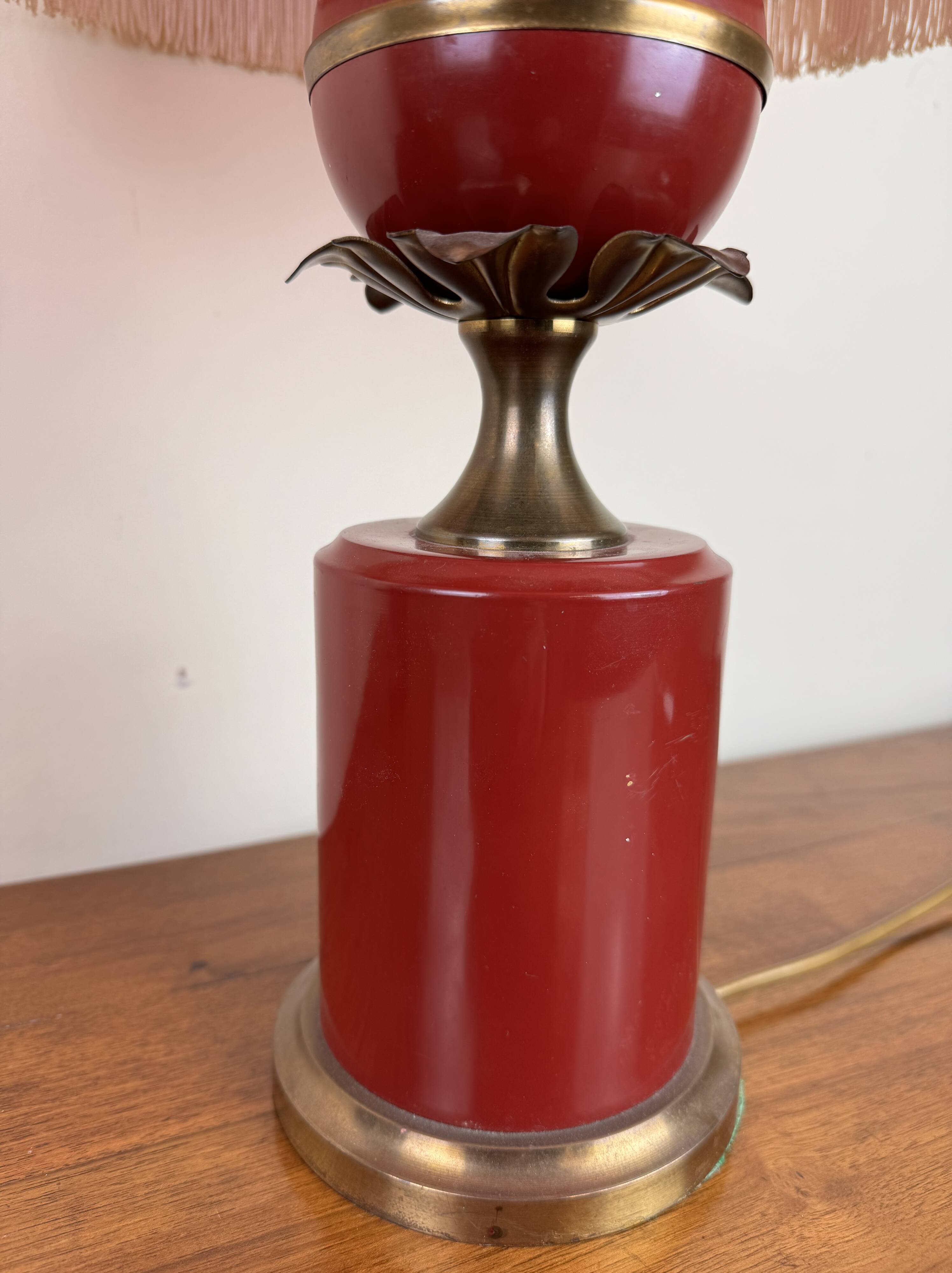 Art deco style desk lamp with a burgundy red sphere in the center the body is in lacquered iron