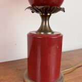 Art deco style desk lamp with a burgundy red sphere in the center the body is in lacquered iron