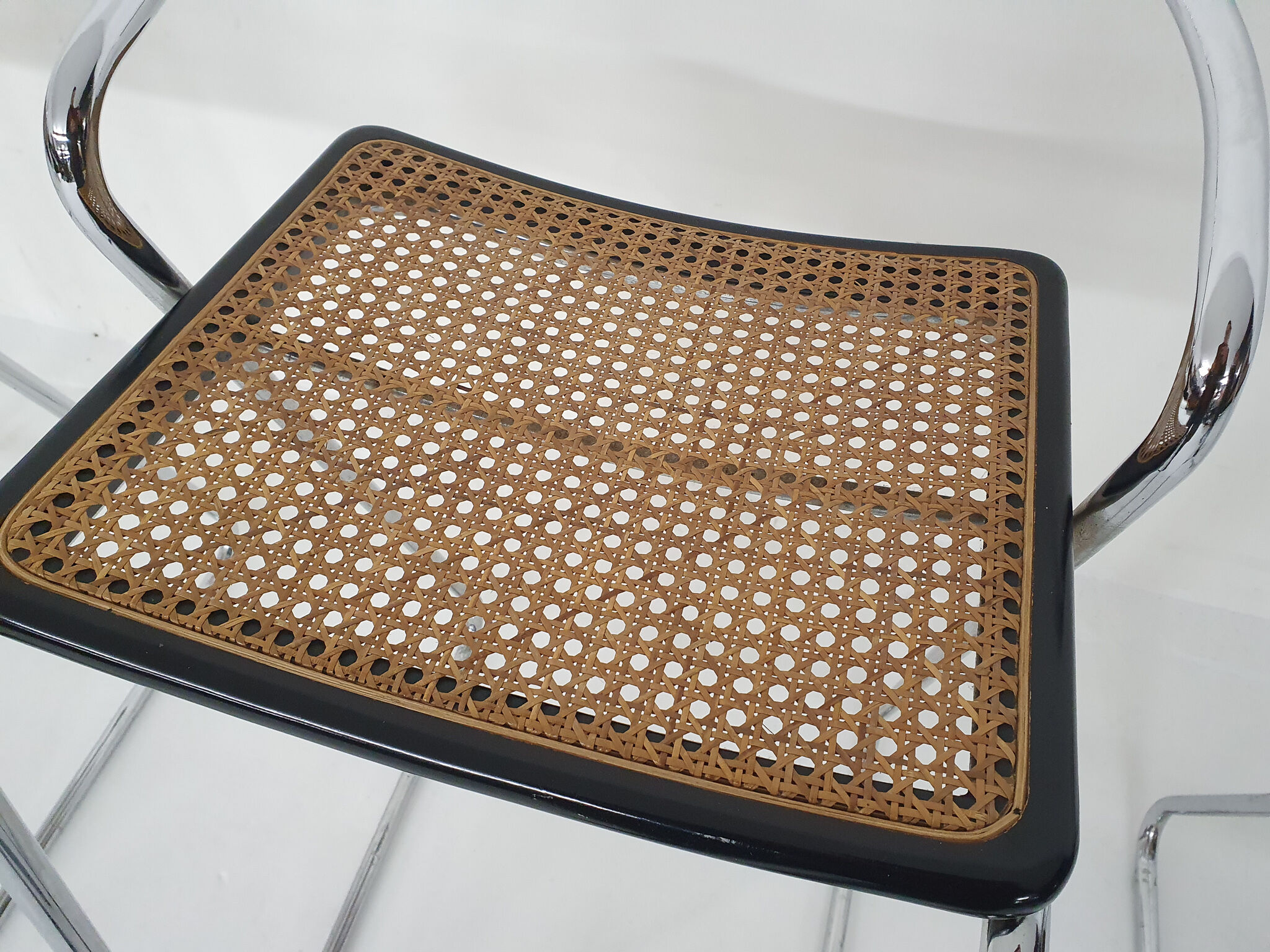 Set of four chrome and cane bar stools, 1970's