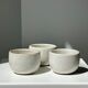 Trio of white ceramic cups D9cm