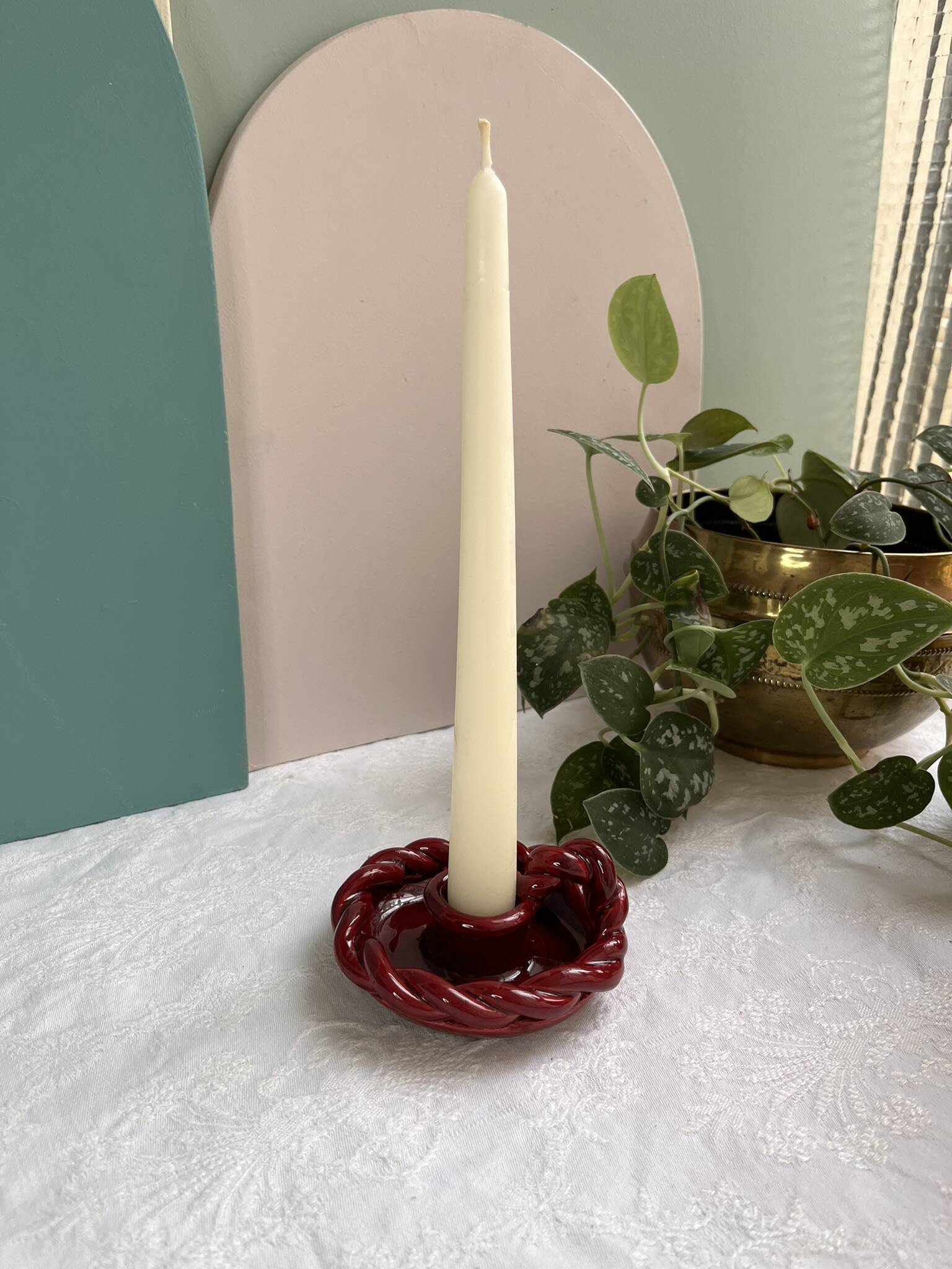 Twisted red earthenware candle holder - in the style of St Clément