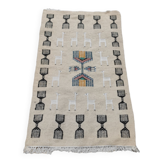 Kilim beige carpet with gazelle patterns