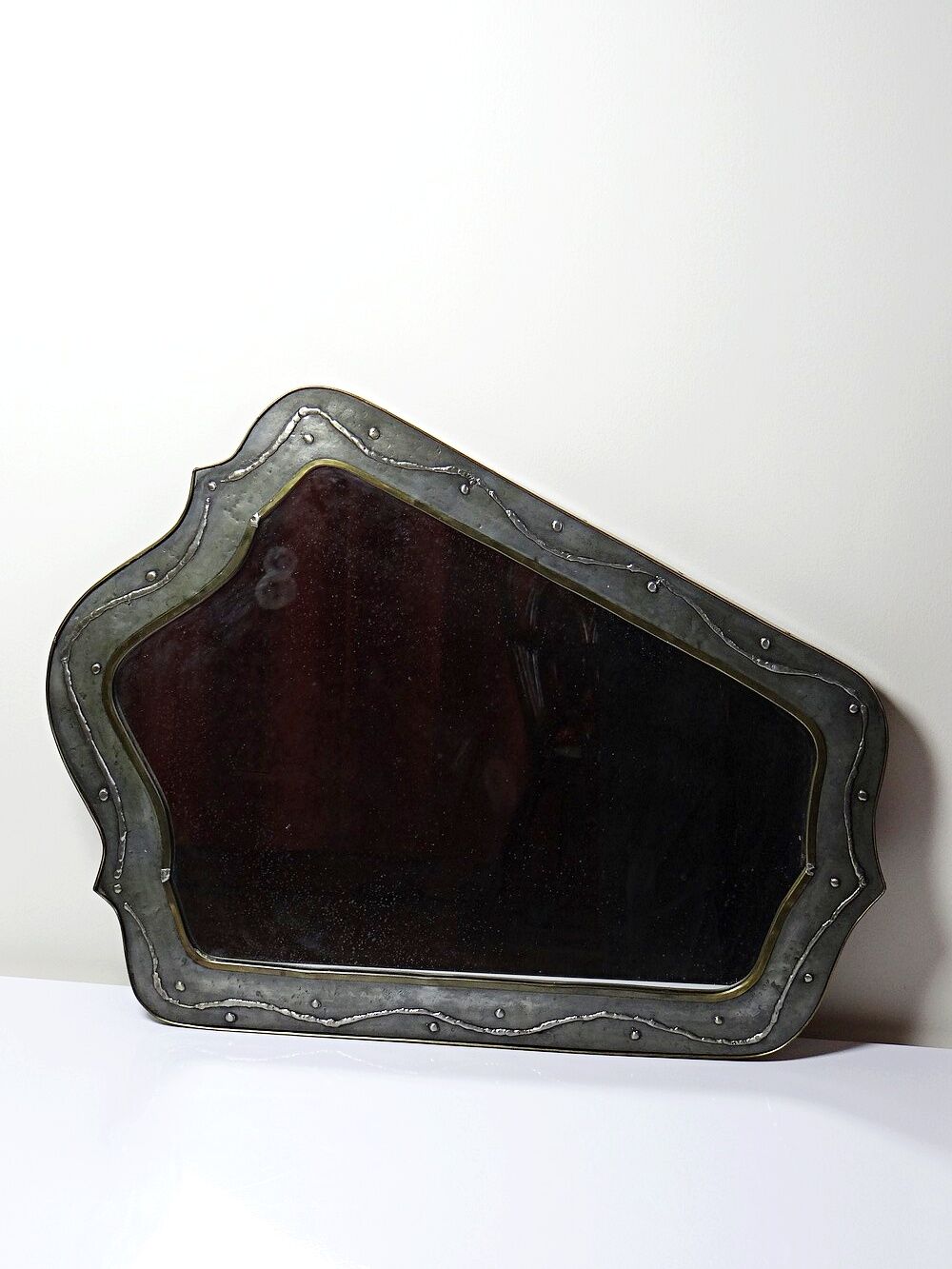 Brutalist mirror by Jean Goardère, brass and tin, 1970s.