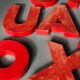 Lettres d'enseigne en zinc rouge formant le mot JOURNAUX