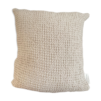 Light beige embossed cushion