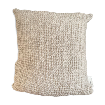 Light beige embossed cushion