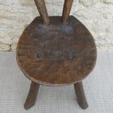 Brutalist chair in carved solid wood, around 1950.