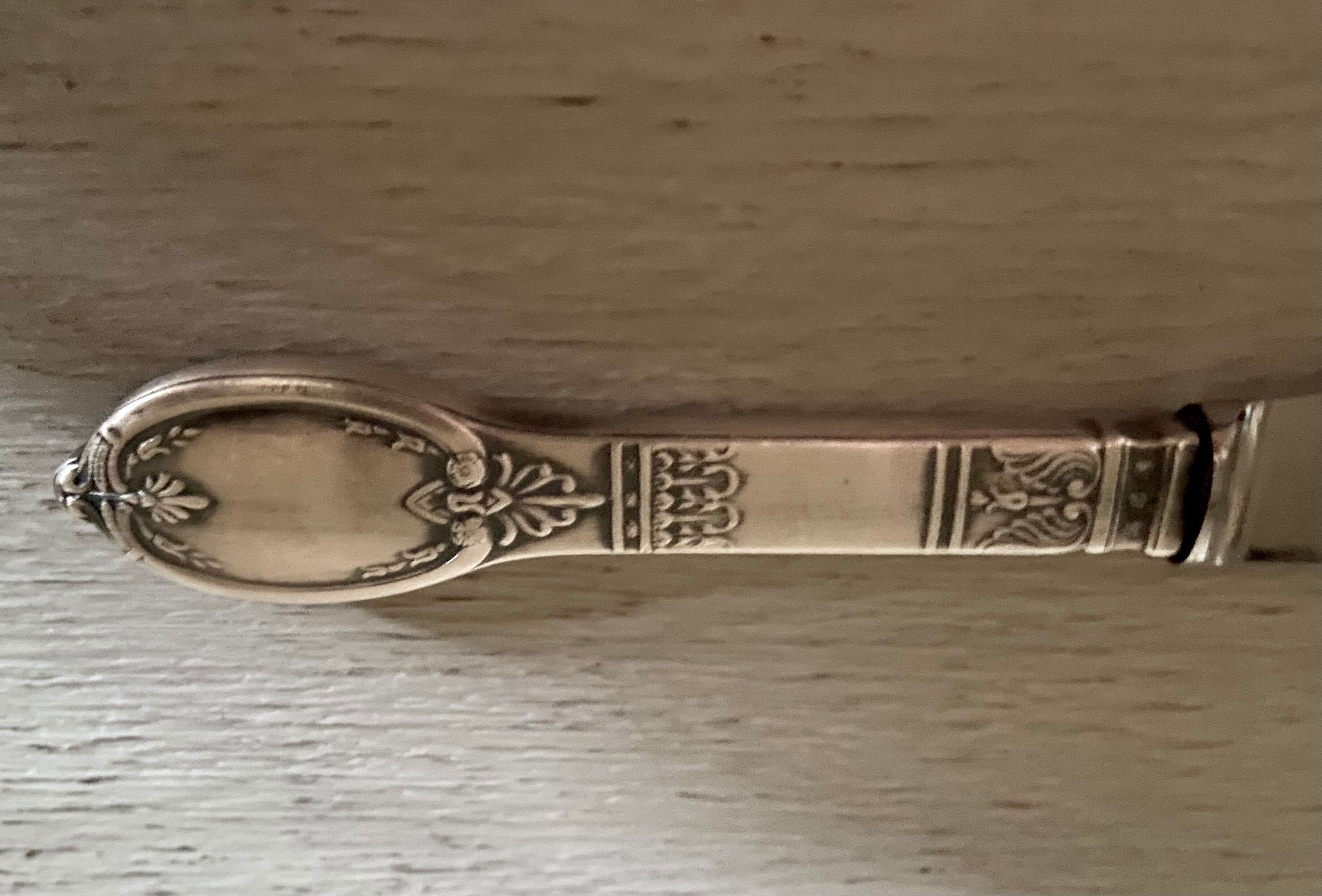 Old silver metal paper cutter