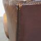 Comfortable, elegant, stately wing chair made of sheepskin in a beautiful warm color