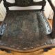Fauteuil ancien en bois sculpté