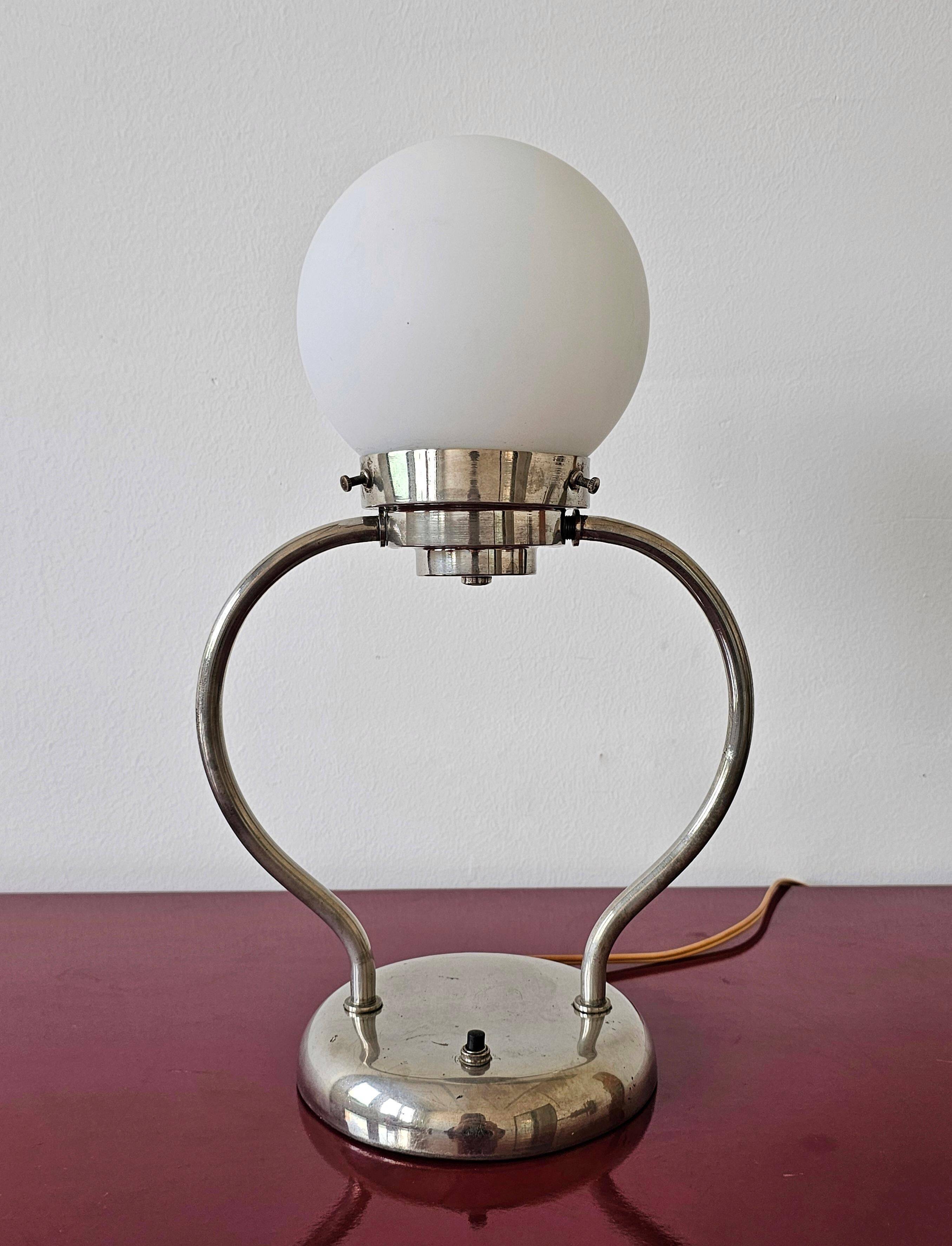 Art Deco table lamp with a spherical opaline glass shade and chrome base from the 1930s.
