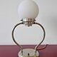Art Deco table lamp with a spherical opaline glass shade and chrome base from the 1930s.
