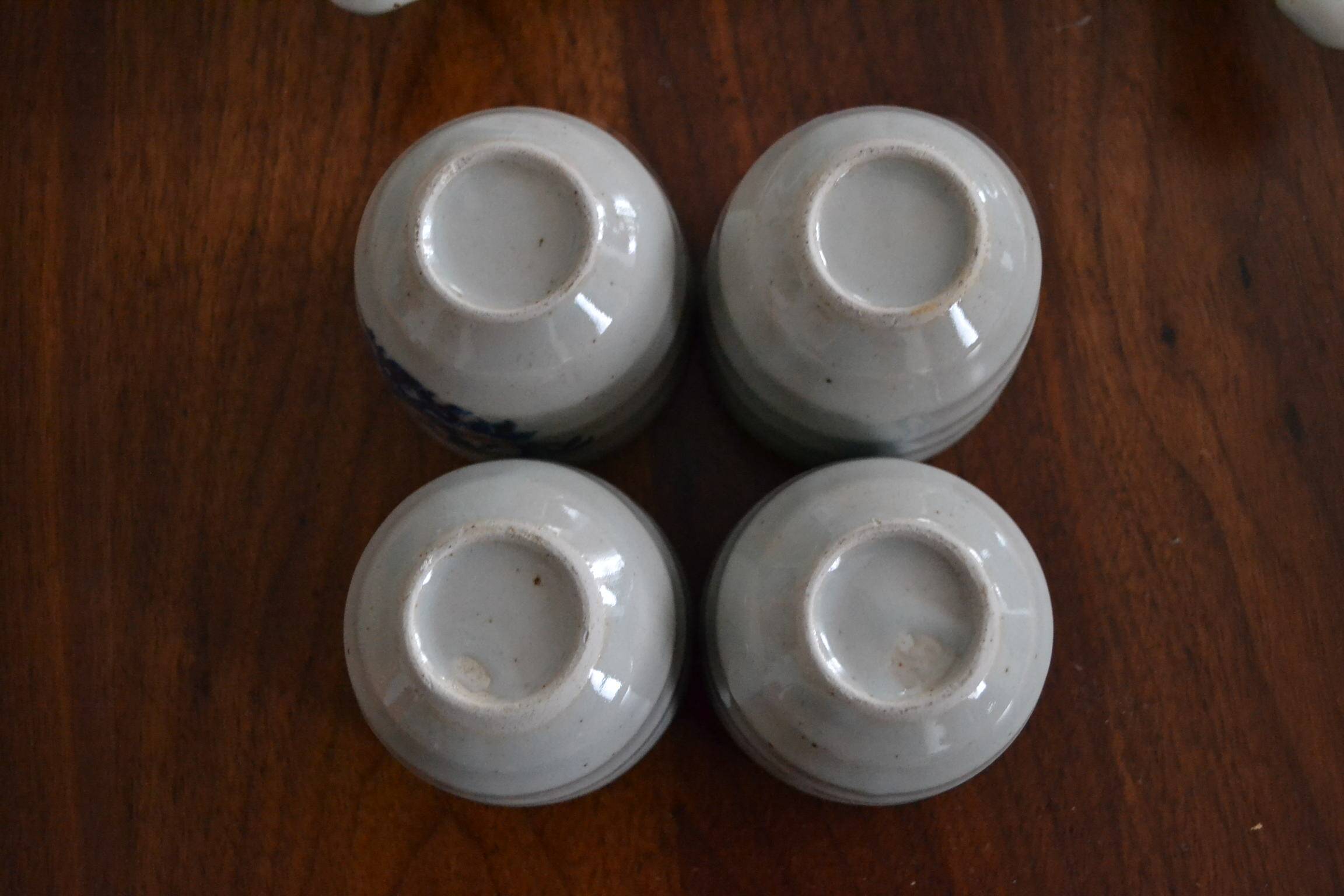 Set of 4 small stoneware tea bowls.