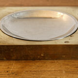 Picks up brass counter money