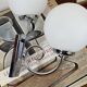 Paire d'appliques murales en inox et globe en verre blanc