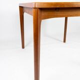 Dining table with extentions in teak designed by Henning Kjærnulf from the 1960s.