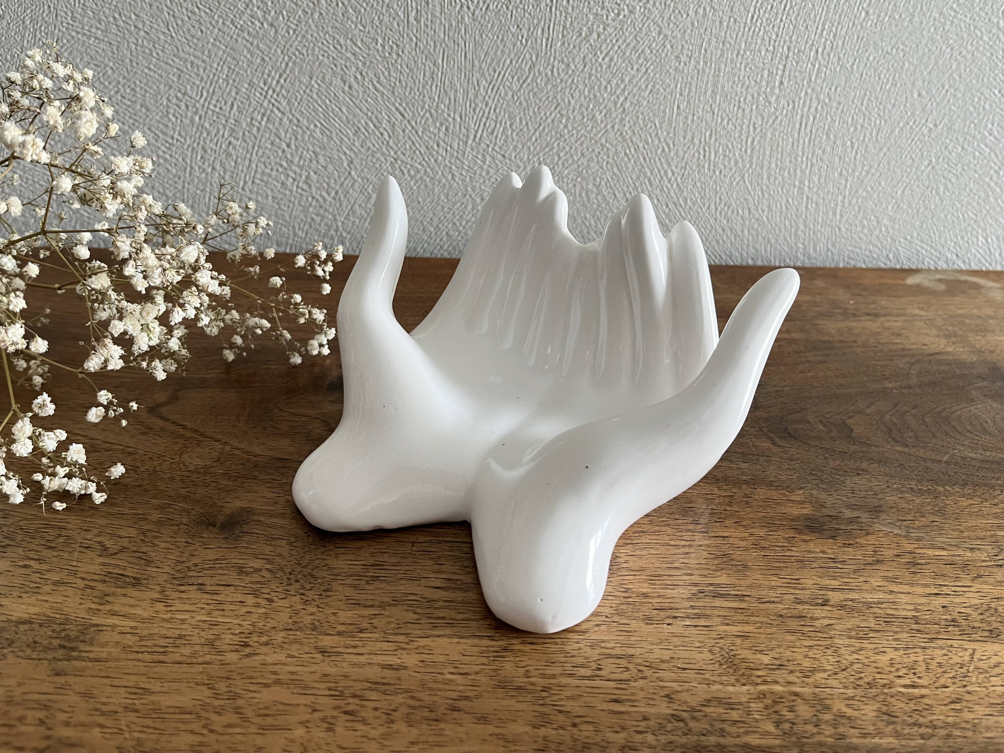 Empty white ceramic hand pocket