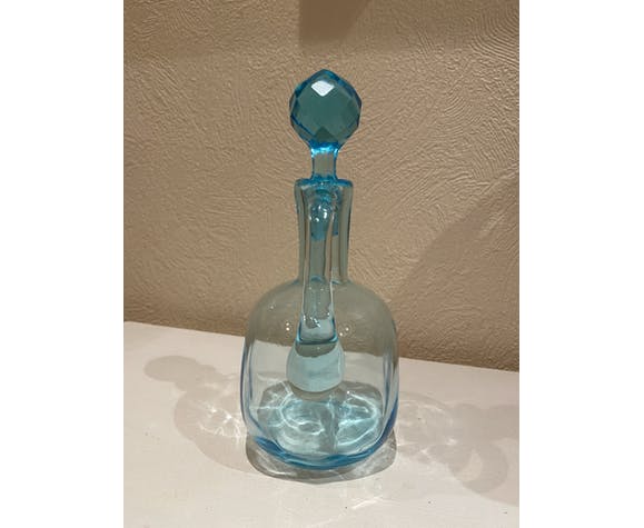 Blue carafe with vintage button