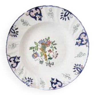 Old ceramic plate of the eighteenth century of Rouen France with cornucopia