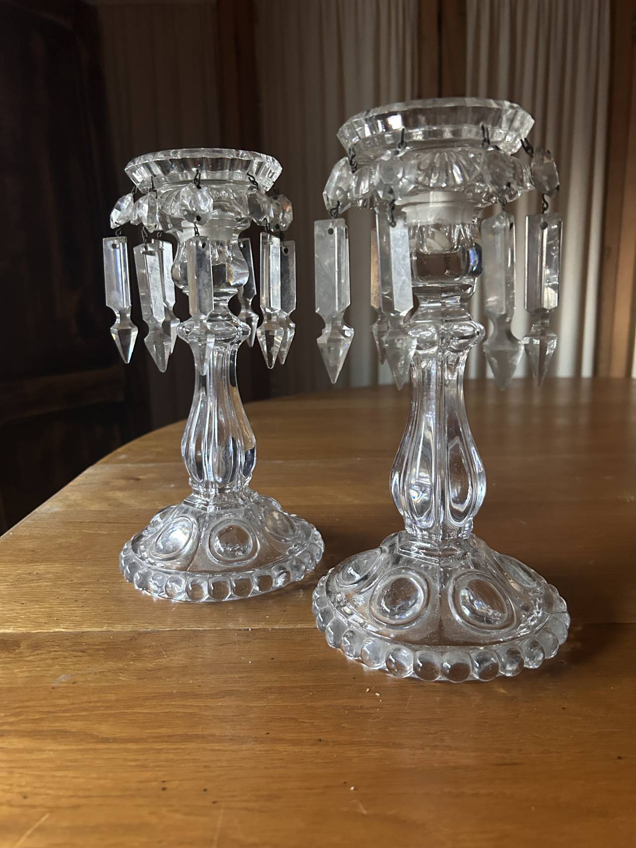 Pair of large Baccarat crystal candlesticks with pendants, a rare choice.