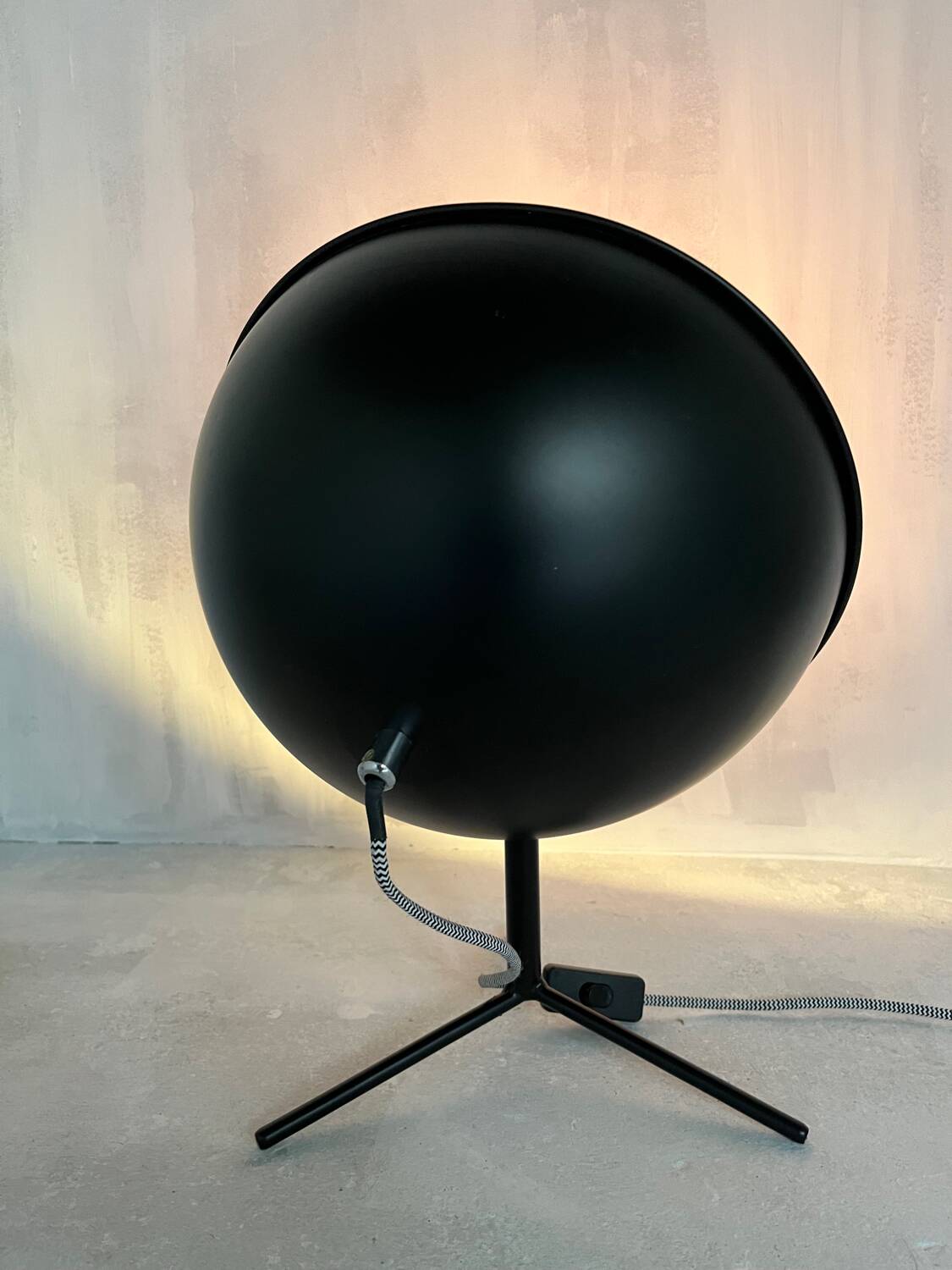 Vintage industrial lamp with a metal frame.