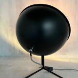 Vintage industrial lamp with a metal frame.