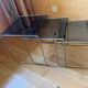 Nest of coffee tables in glass and metal.