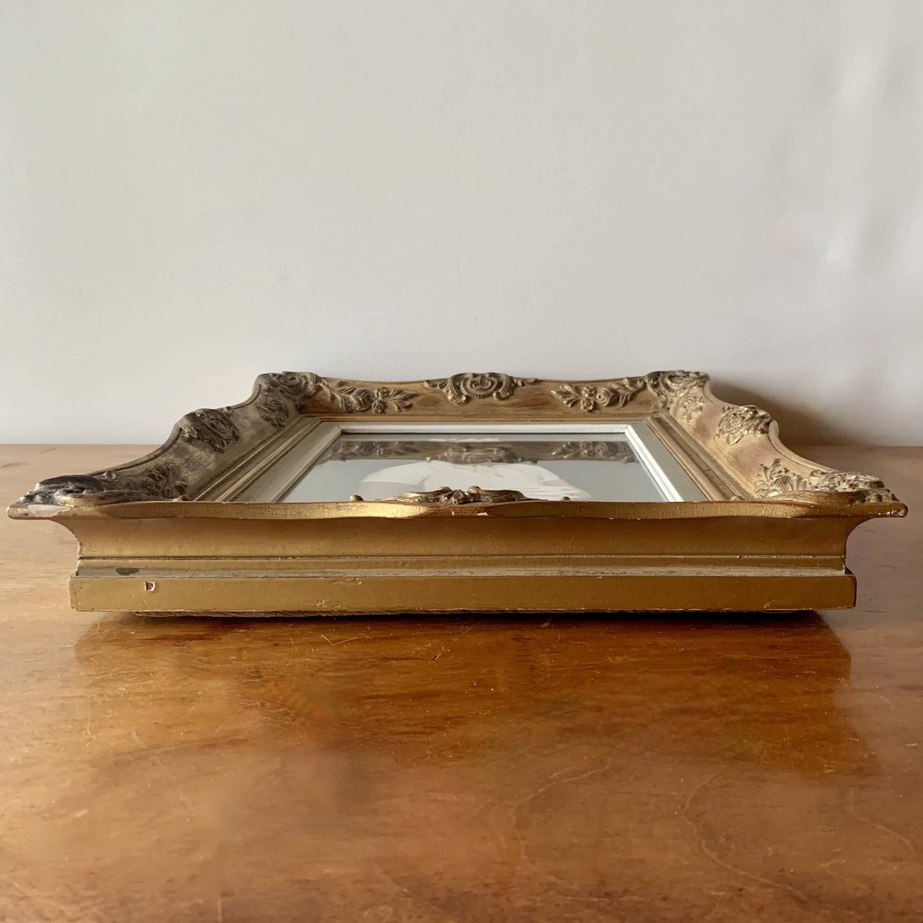 Old gilded carved wooden wall frame