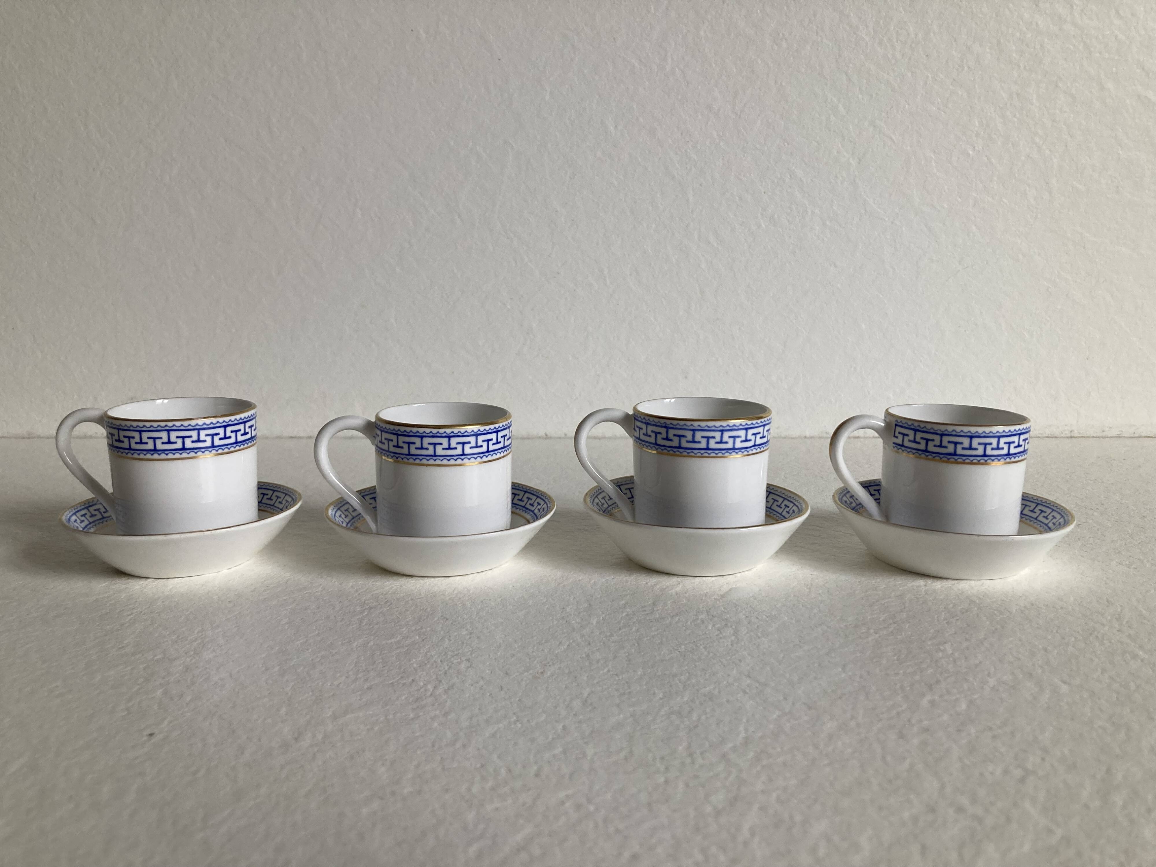 4 coffee cups and saucers