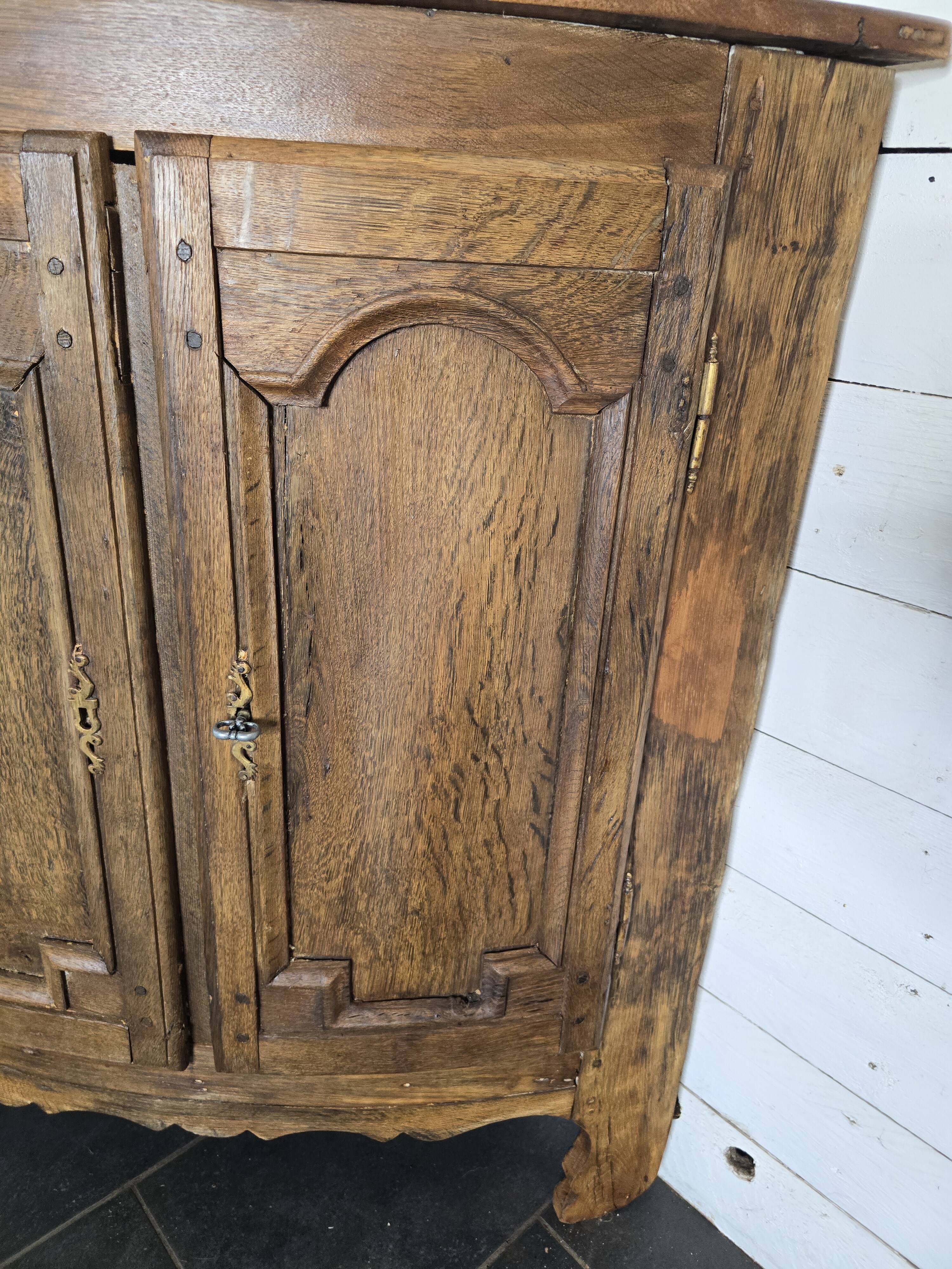 19th century curved corner cupboard in oak