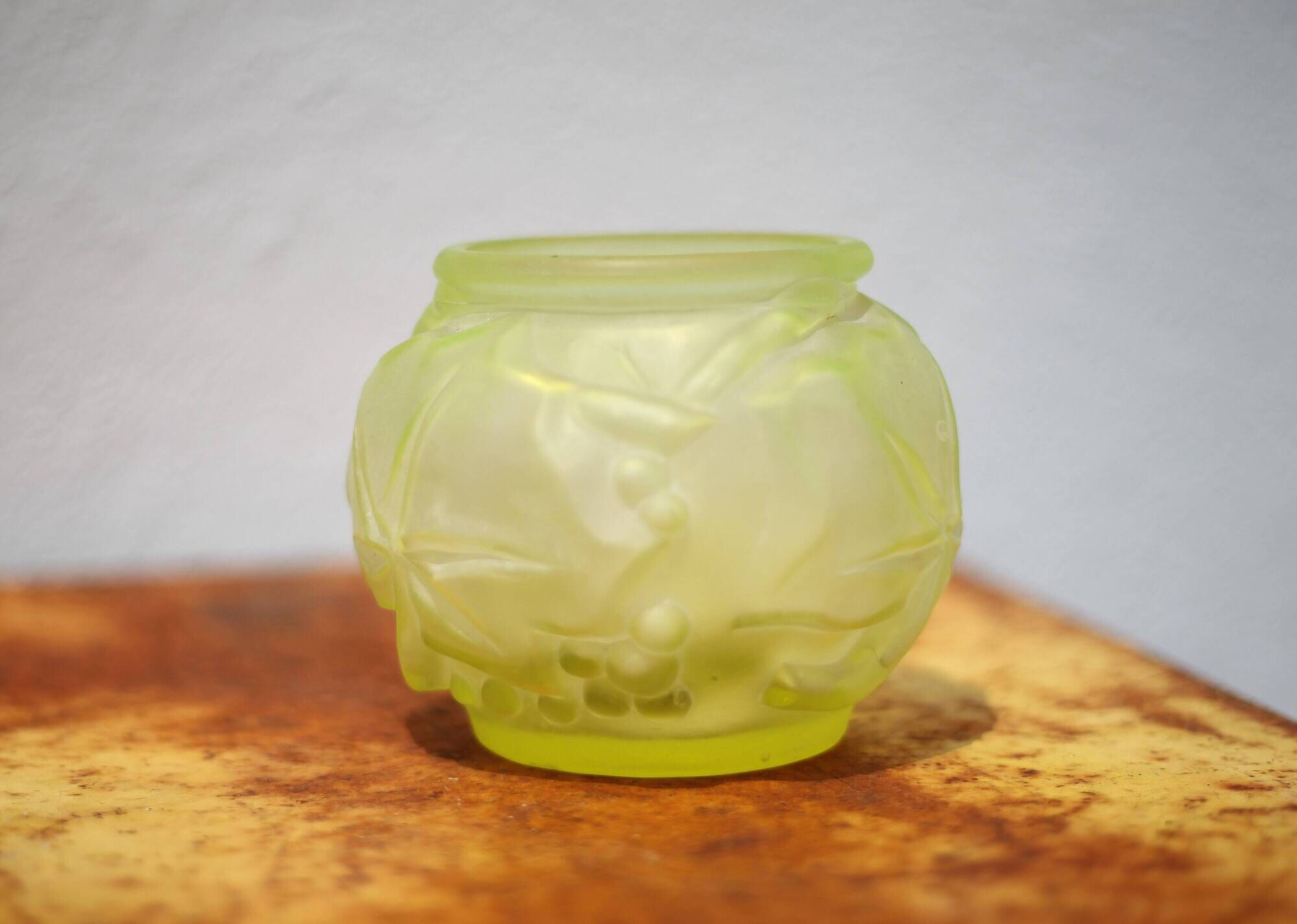 Fluorescent yellow ball vase with vine leaf patterns