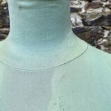 Old mannequin on wooden and fabric stand