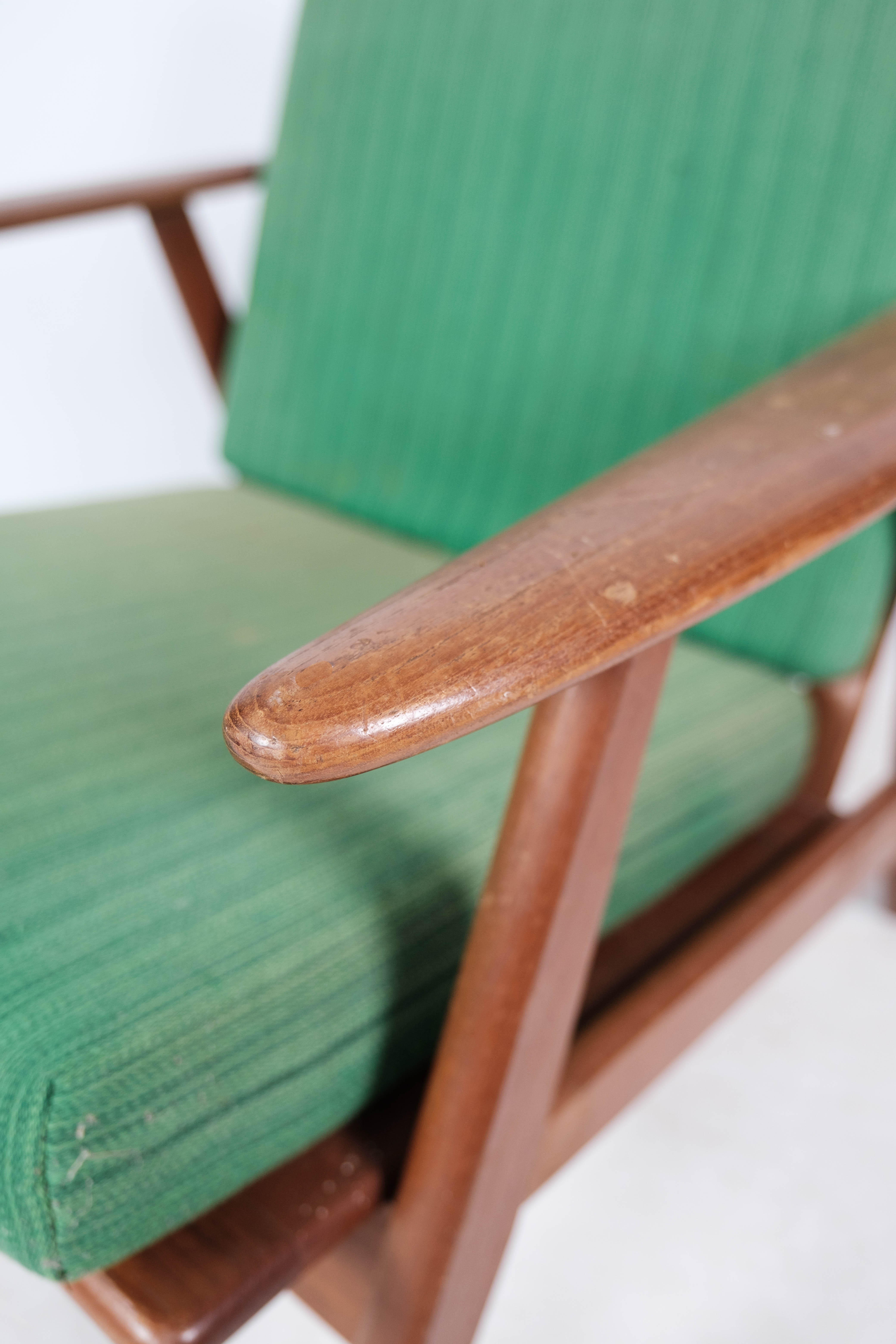 Easy chair in teak and with green upholstery of Danish design, 1960s