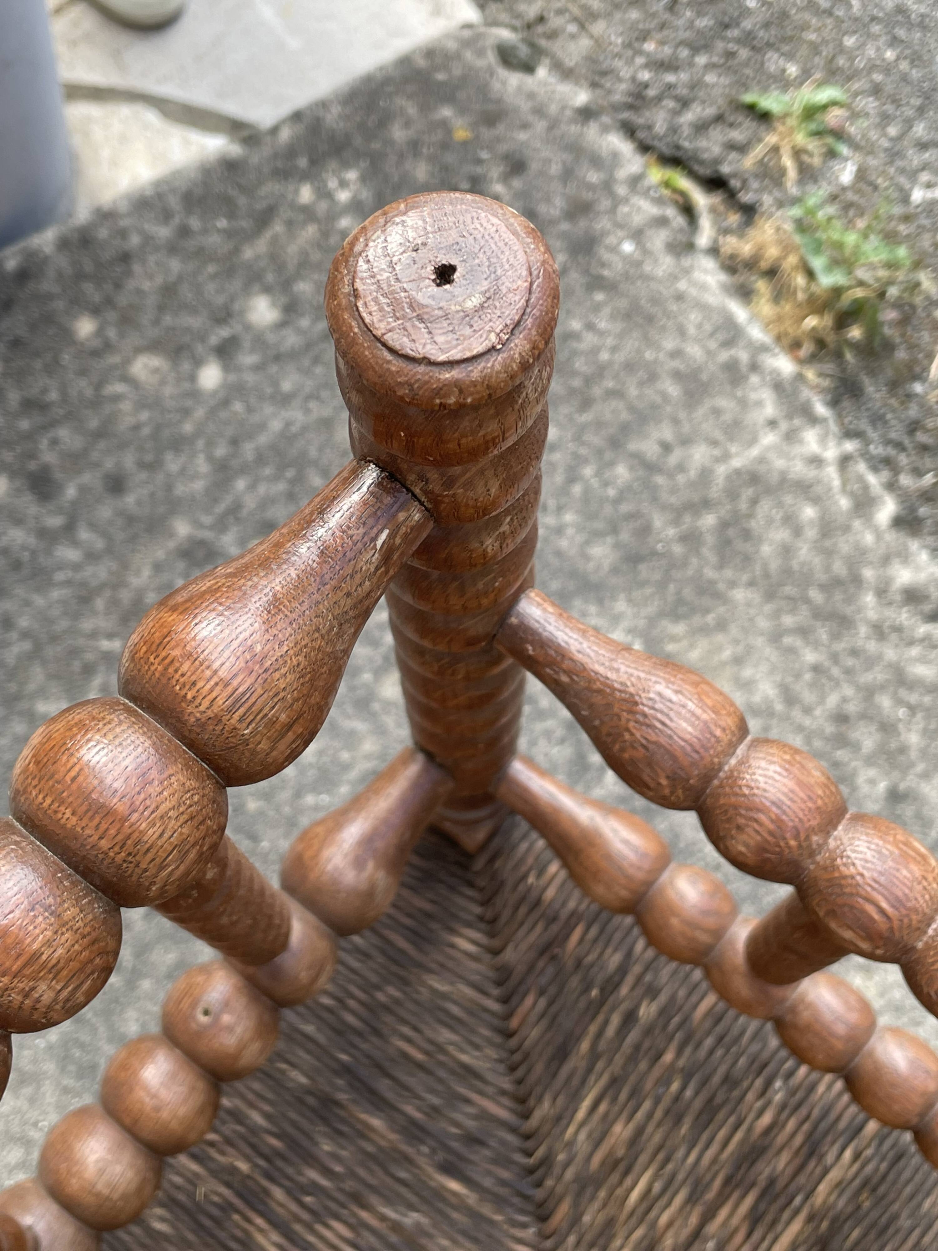 Antique Bobbin armchair with straw seat