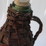 Ancient bottle in wicker