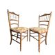 Two floral upholstered music chairs from the early 20th century.