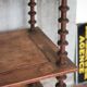 Napoleon III spool shelf, floor-standing shelf with brass tips.