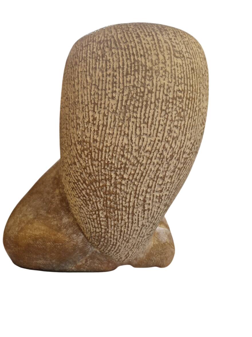 Sculpture of a lion in stone by Islay Grimes.