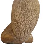 Sculpture of a lion in stone by Islay Grimes.