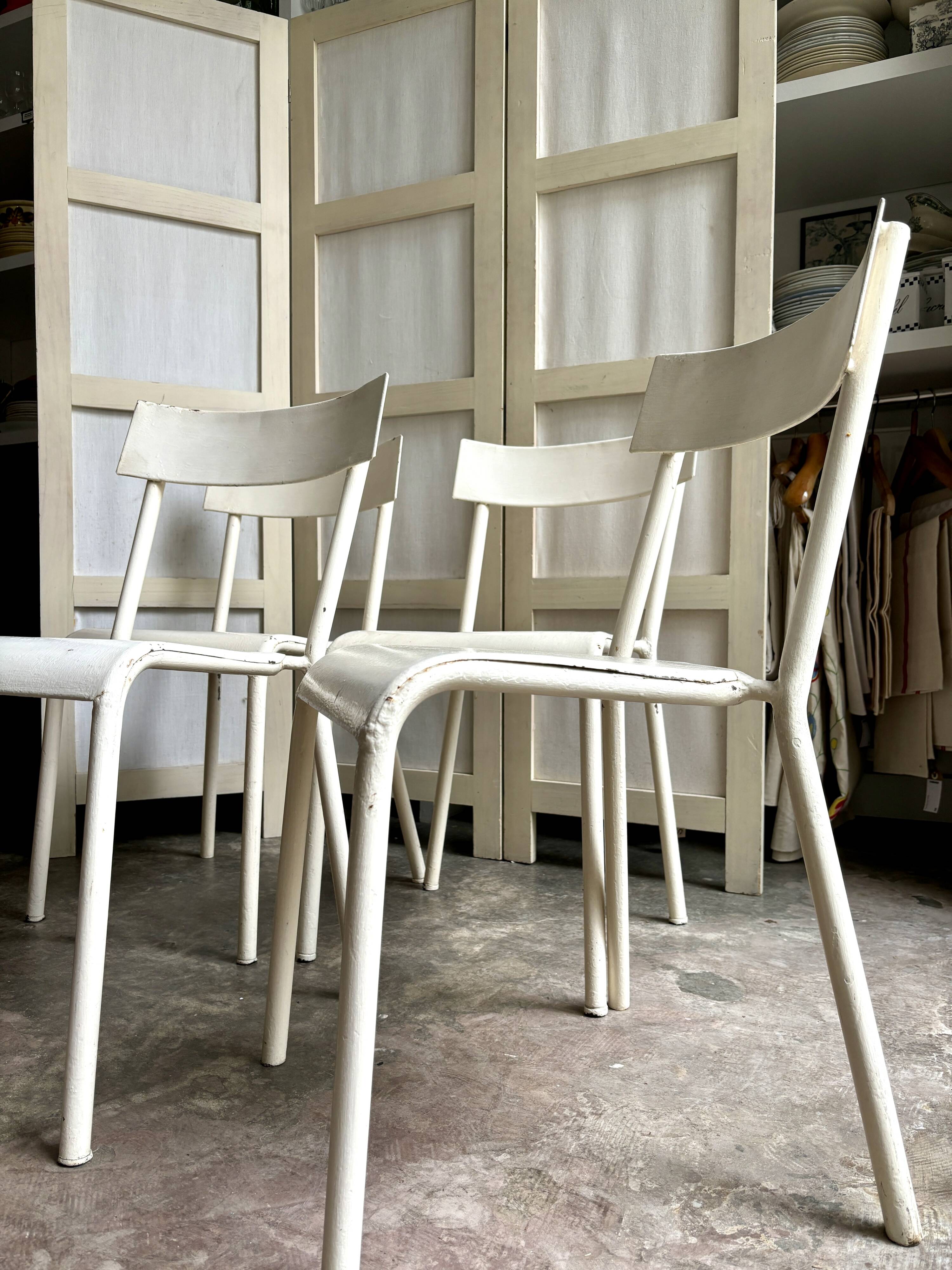 4 beige metal garden chairs