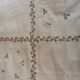 Old embroidered oval tablecloth