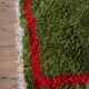 Handmade pure wool rug in green and red, size 140/260 cm.