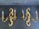 Pair of Italian Hollywood Regency wall lights in iron and gilded sheet metal.